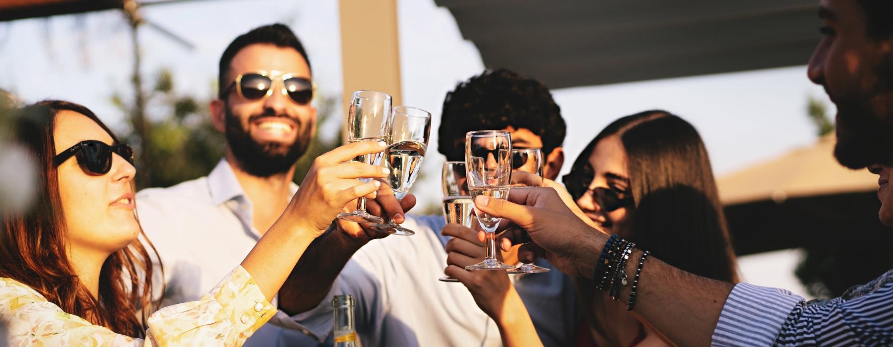 a group of people drinking wine