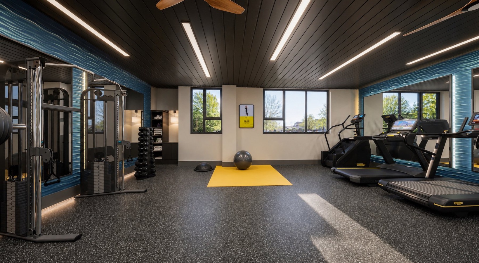 gym with exercise equipment and windows